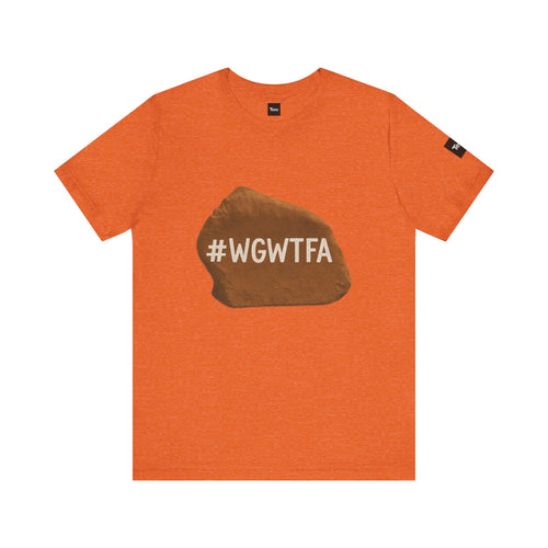 Orange t-shirt with a brown rock graphic and '#WGWTFA' text on a white background